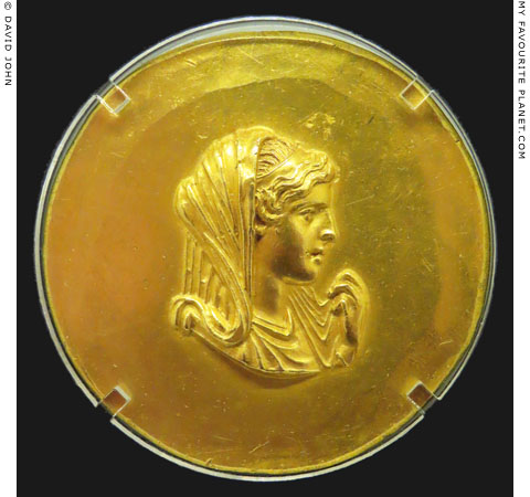 A portrait of Olympias, mother of Alexander the Great, on a gold Aboukir medallion in Thessaloniki at My Favourite Planet A portrait of Olympias, mother of Alexander the Great, on a gold Aboukir medallion in Thessaloniki at My Favourite Planet