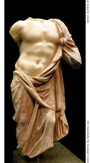 Fragment of a marble statuette of Asklepios with a red himation at My Favourite Planet
