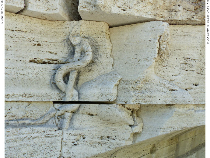 The relief of Aesculapius on the facade on the Tiber Island, Rome at My Favourite Planet