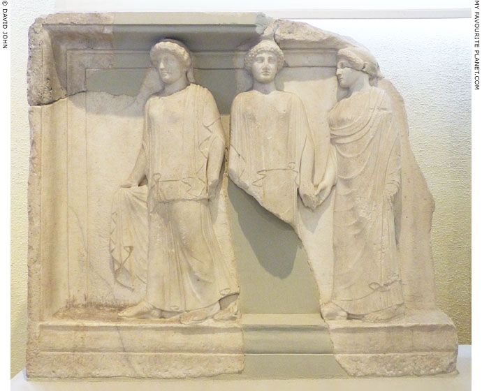 A marble relief of the Three Graces in Piraeus at My Favourite Planet