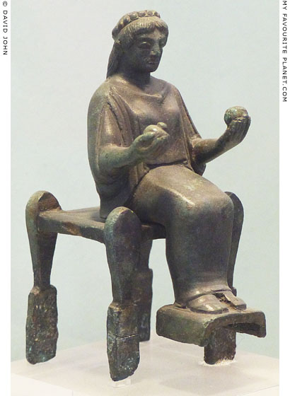 Bronze figurine of a seated female holding fruits from Arcadia at My Favourite Planet