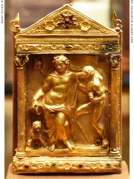A gold relief of drunken Dionysus with a panther and Satyr in a naiskos at My Favourite Planet