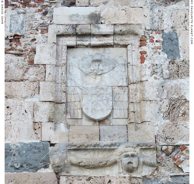 Marble theatrical masks on the wall of the north side the Nerantzia Fortress, Kos at My Favourite Planet