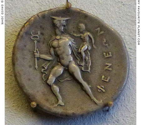 A silver stater of Pheneos showing Hermes carrying the infant Arkas at My Favourite Planet
