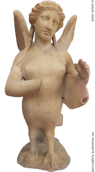 Statue of a Siren playing a lyre from Kerameikos, Athens at My Favourite Planet Statue of a Siren playing a lyre from Kerameikos, Athens at My Favourite Planet