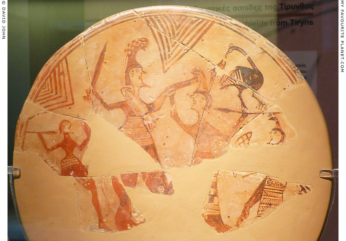 A warrior killing an Amazon on a terracotta votive shield from Tiryns at My Favourite Planet