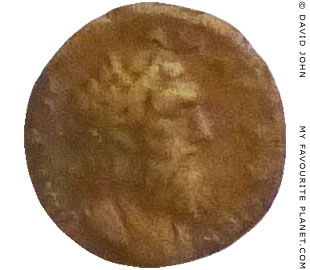Bronze coin showing the head of Homer at My Favourite Planet