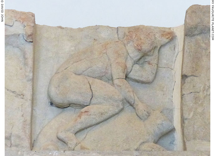 A metope with a relief of Odysseus or Theseus riding a turtle at My Favourite Planet