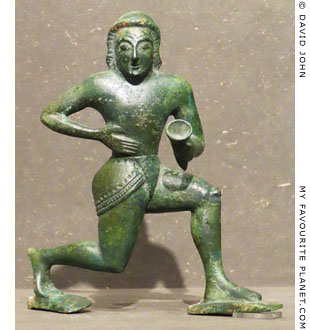 A bronze figurine of a komast running in the Knielauf position at My Favourite Planet A bronze figurine of a komast running in the Knielauf position at My Favourite Planet