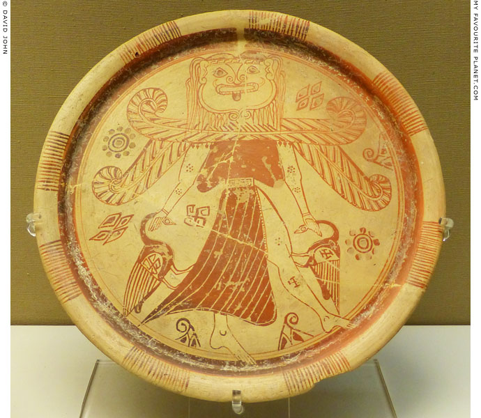 A plate showing a winged goddess with a Gorgon head at My Favourite Planet