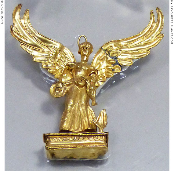 Gold pendant in the form of a winged Nike at My Favourite Planet